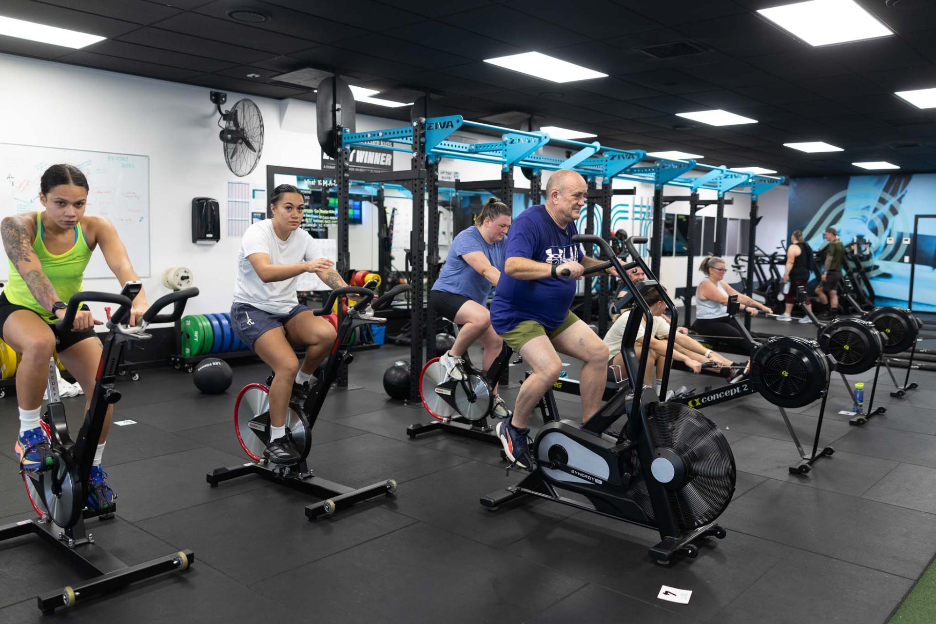 Bikes and rowers lined up during a cardio block